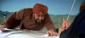 Henchman Gobinda and Bond duke it out at 20,000 feet atop a flying plane